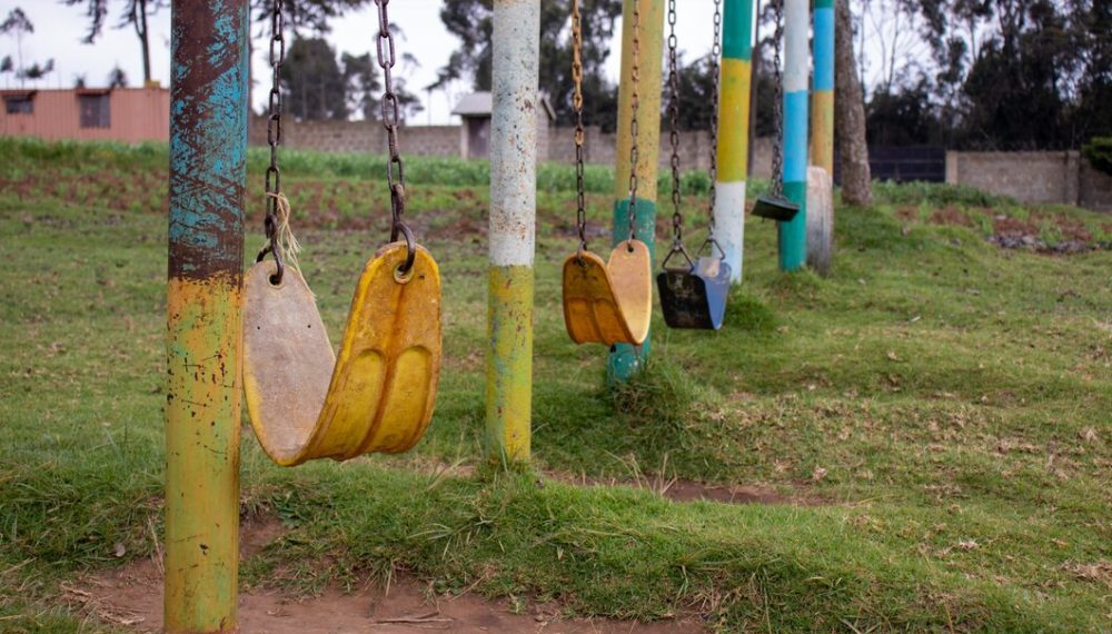 park-with-lot-old-weathered-chain-swings_181624-27169
